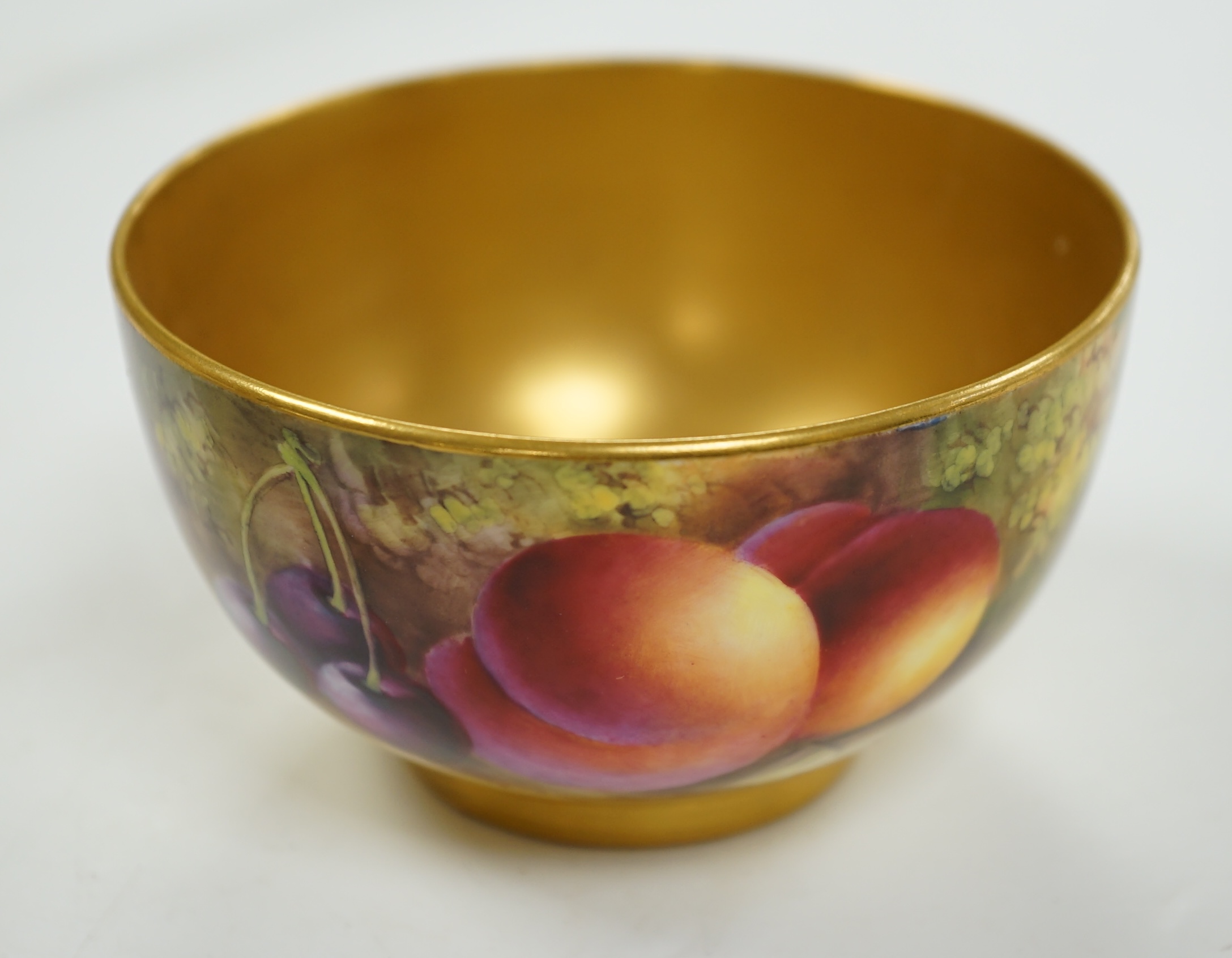 A Royal Worcester fruit painted bowl by Harry Ayrton, 9cm diameter. Condition - good